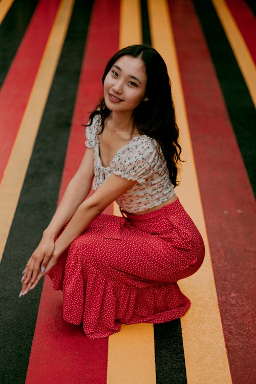 Brunette in Blouse and Long Red Skirt