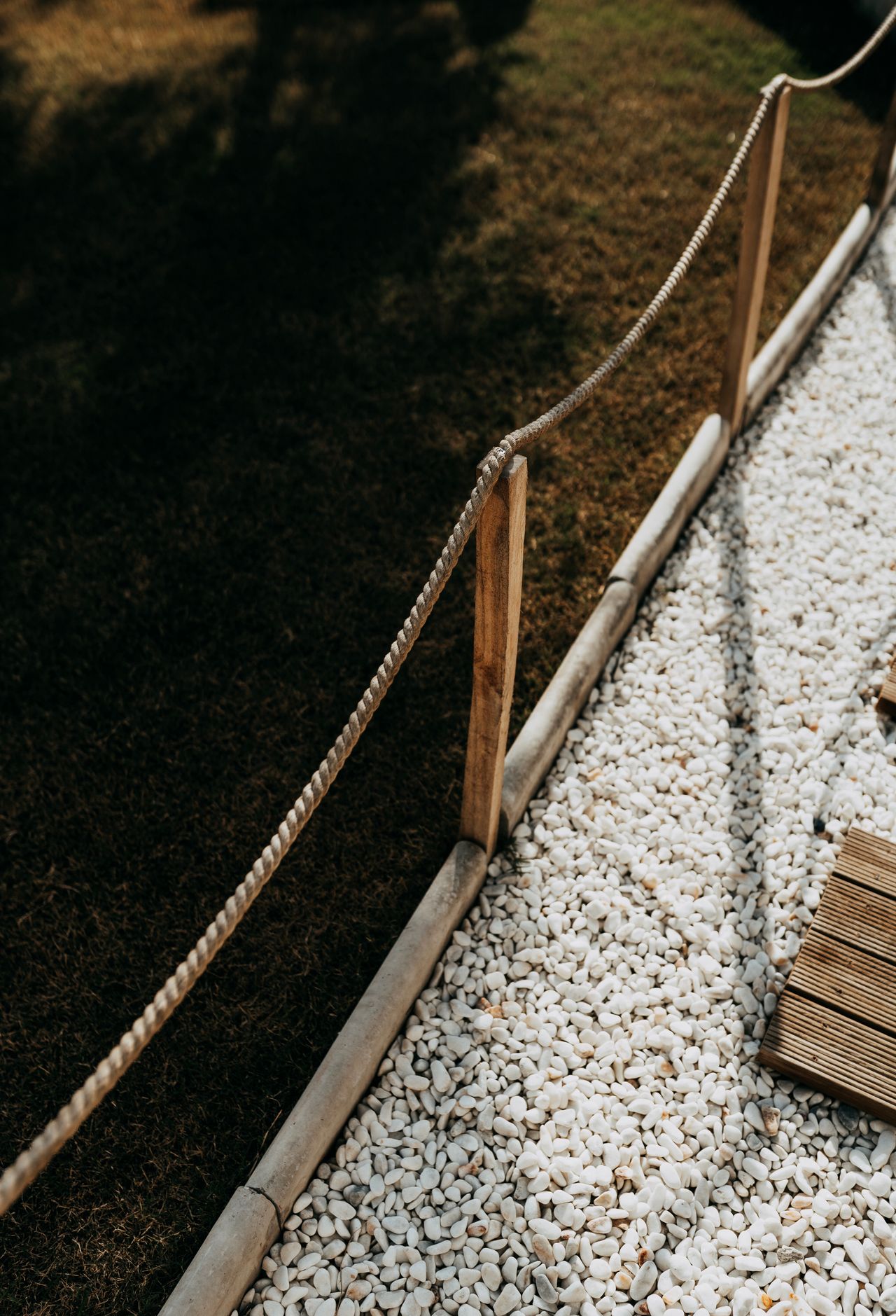 braided-nautical-rope-edging Rustic rope fence along a garden path
