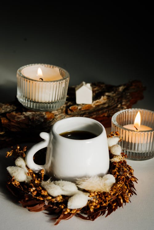 Coffee Pot and Burning Candles 