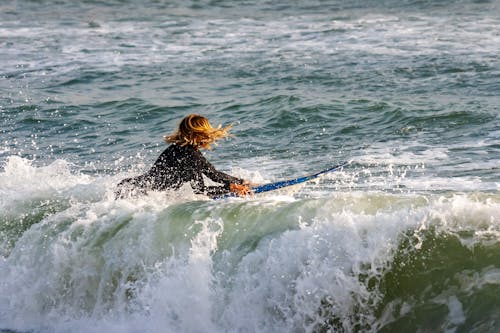 Woman Surfing on a Big Wave 