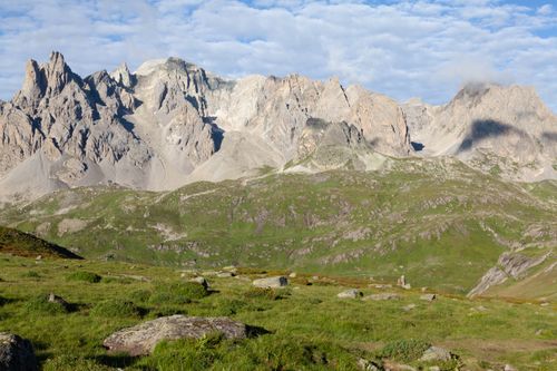 Free Scenic view of rugged mountains and grassy fields in Briançon, Provence-Alpes-Côte d'Azur. Stock Photo
