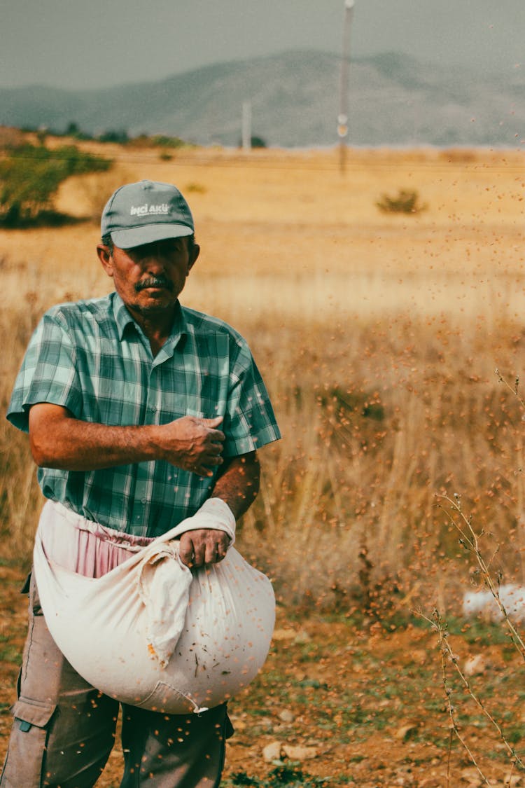 A Farmer Working In A Field