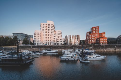 Free Stunning view of Düsseldorf's Rhine River marina with iconic Gehry architecture at Neuer Zollhof. Stock Photo