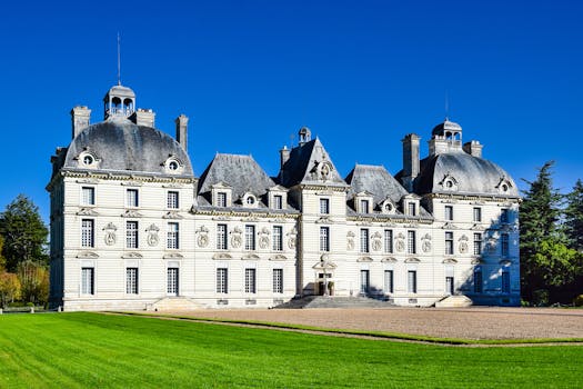 Captivating view of Château de Cheverny, an iconic French landmark, under a clear blue sky.