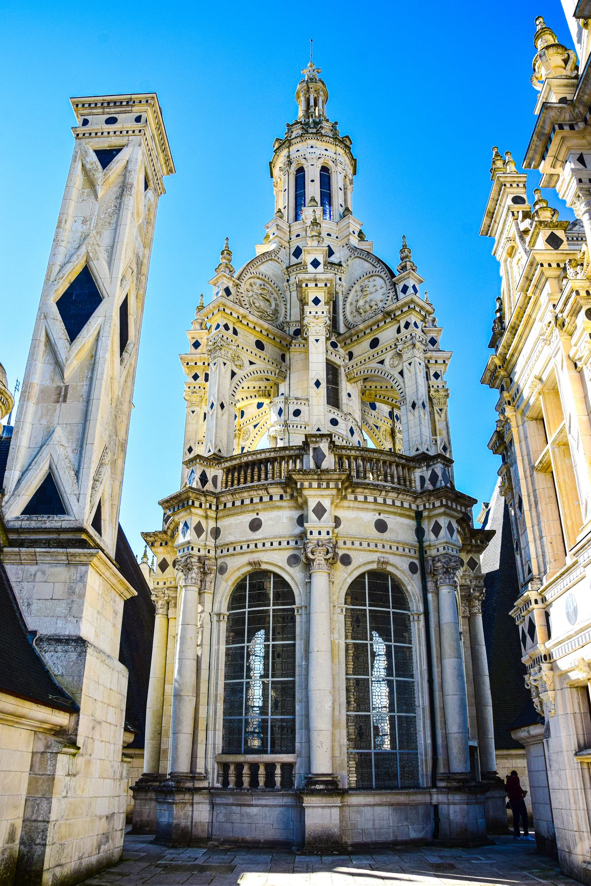 The ornate carved lantern tower and chimneys on Chambord's roof