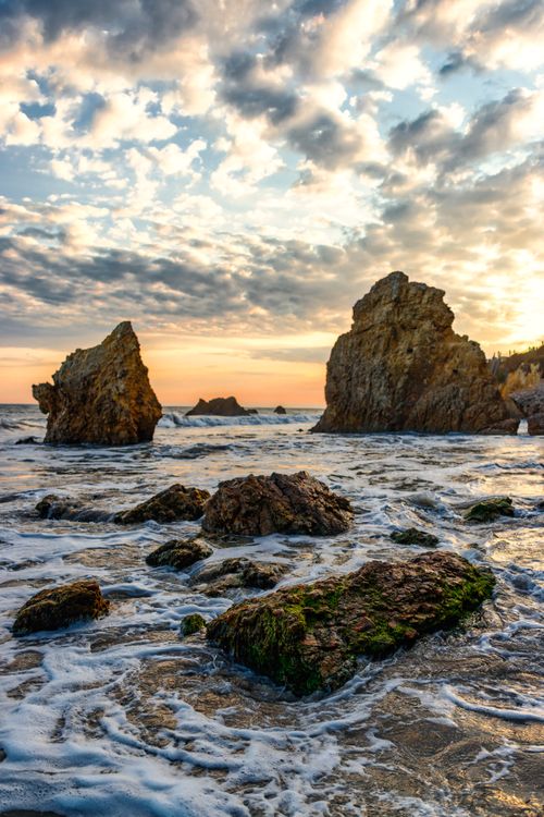 Free Breathtaking view of rocky seascape during sunset in Malibu. Perfect for nature and travel themes. Stock Photo