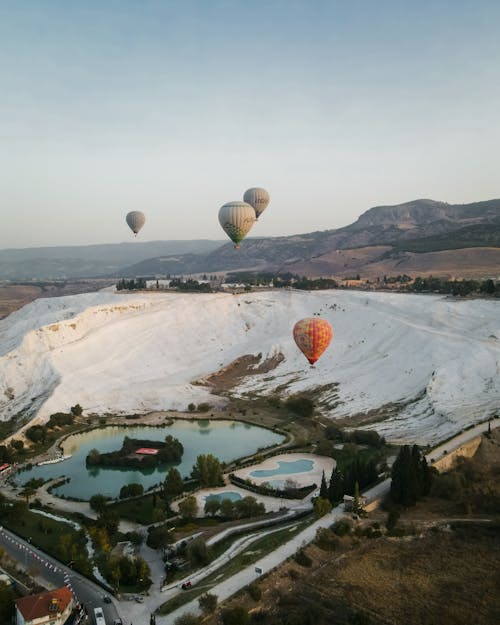 Aerial View of Hot Air Baloons over Piknik Alani Park and Travertines in Pamukkale