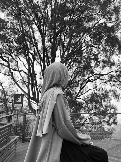 A Woman Sitting Outdoors