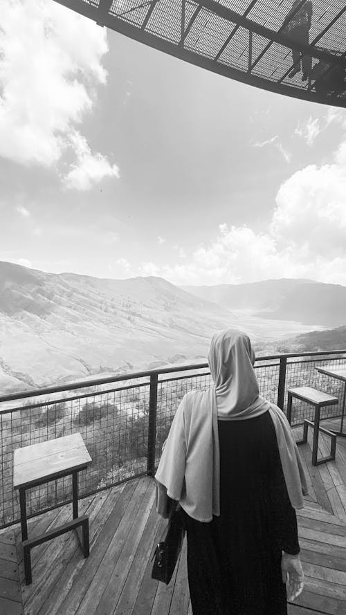 Tourist on the Terrace of an Observation Tower in the Mountains