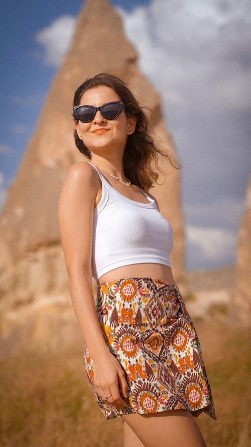 Woman in Sunglasses and Skirt
