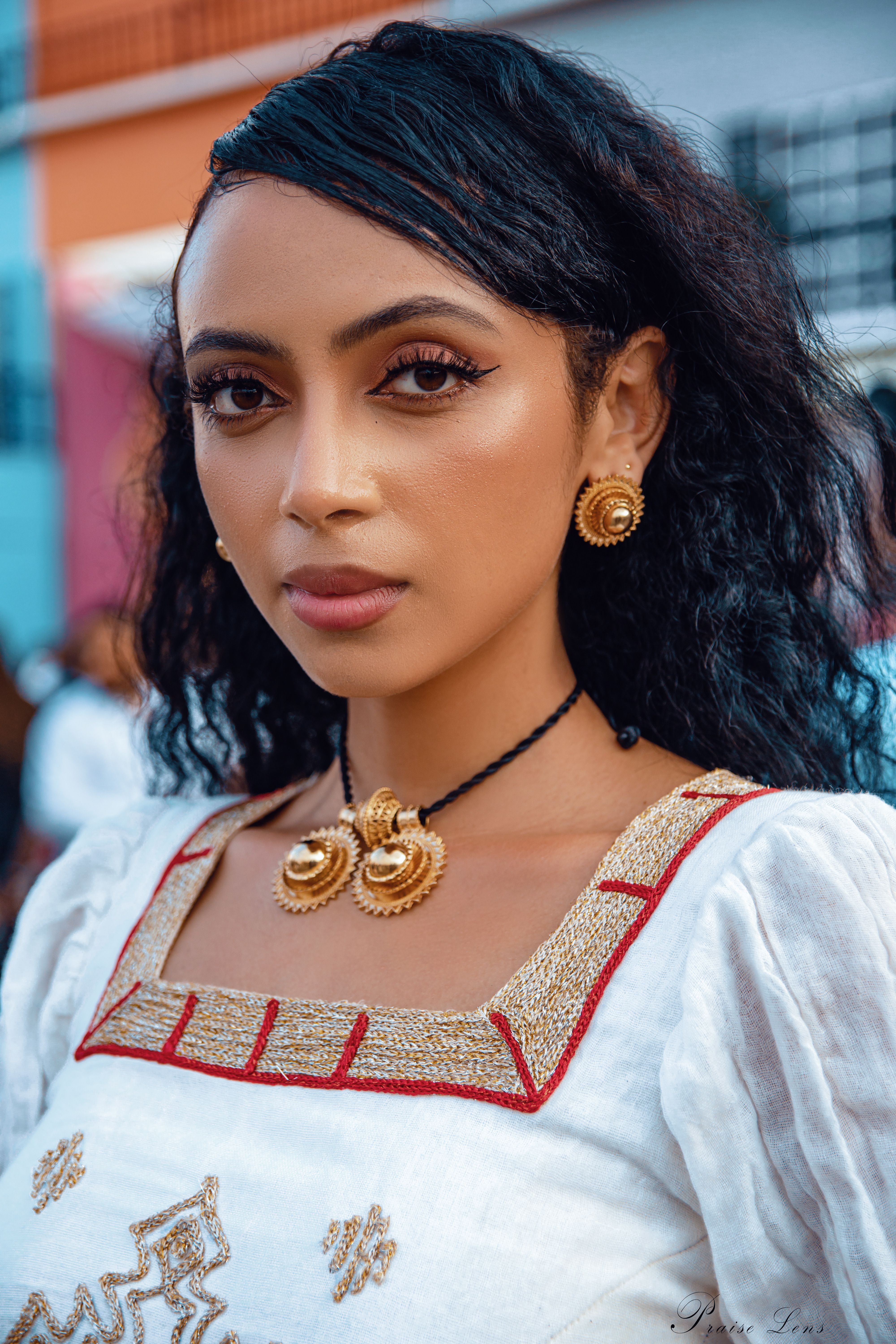 Portrait of Woman with Black Hair and Golden Necklace · Free Stock Photo