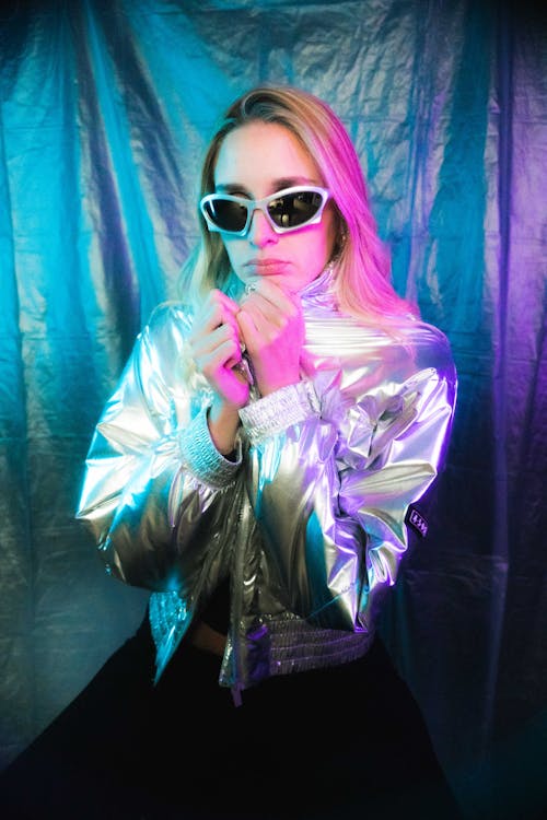 Model in Shiny Silver Jacket and Sunglasses