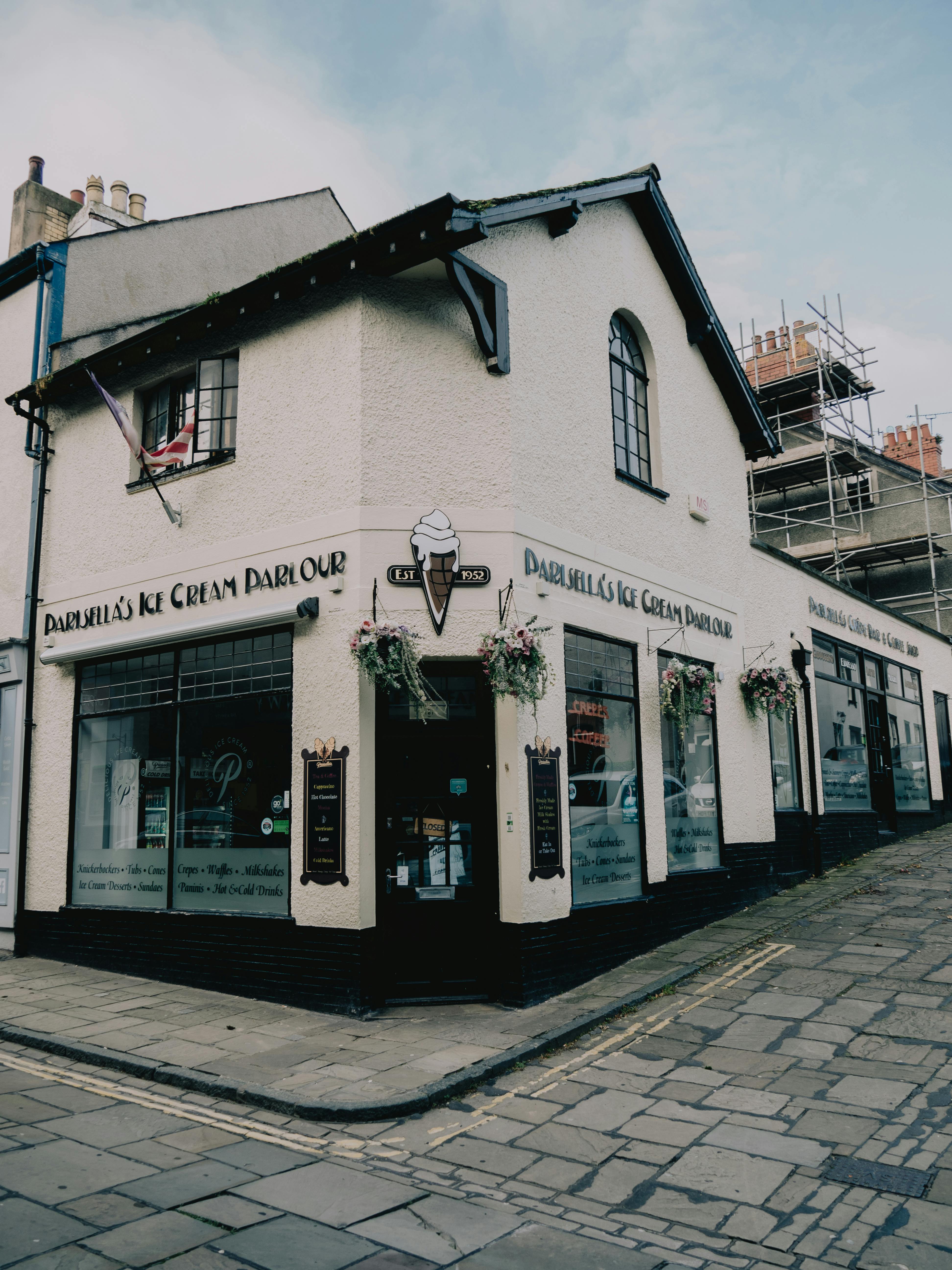 Free The historical Daisebell's Ice Cream Parlour located on a quaint street corner in Conwy, Wales. Stock Photo