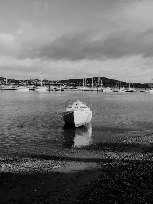 Black and White Shot of a Moored Motorboat 