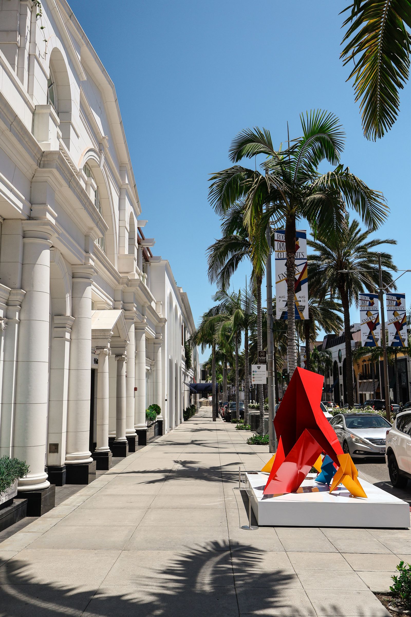 Rodeo Drive in Beverly Hills with luxury storefronts on a sunny day