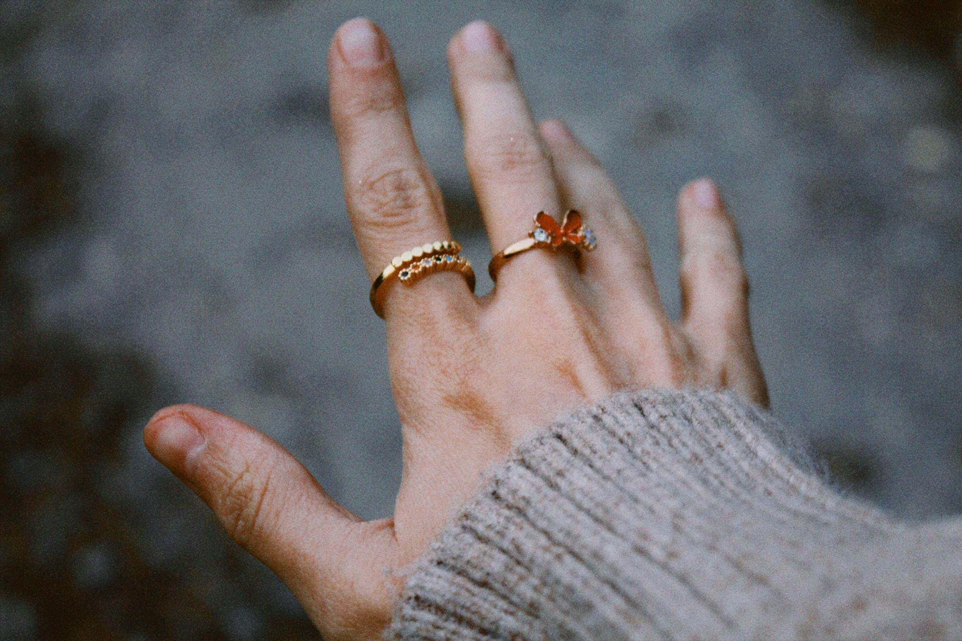 hand with gold rings