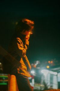 Moody night portrait of a woman in the city, photo by Bui Van Dong on Pexels