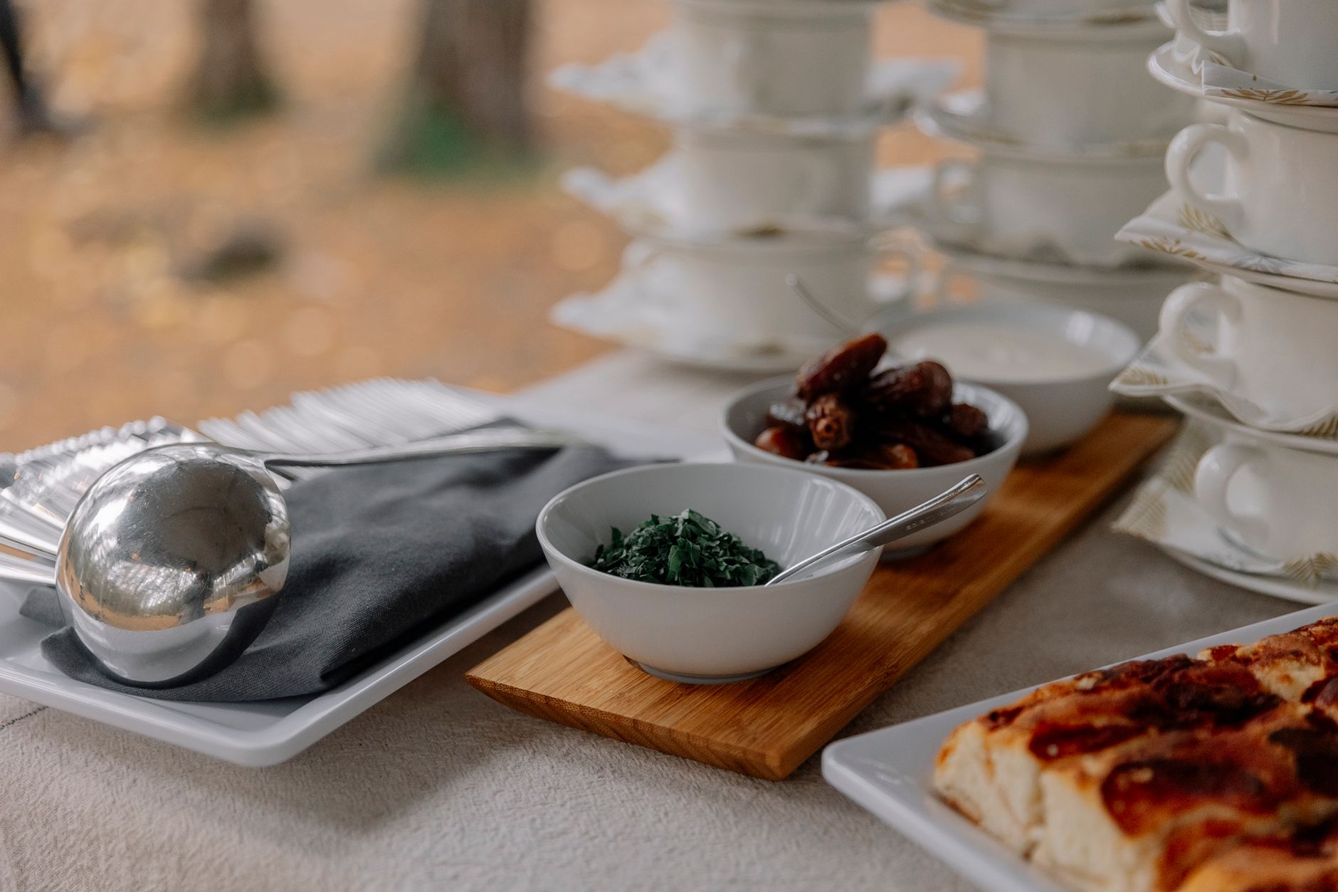 Close-up of a stylish brunch table setting with elegant tableware and savory treats.