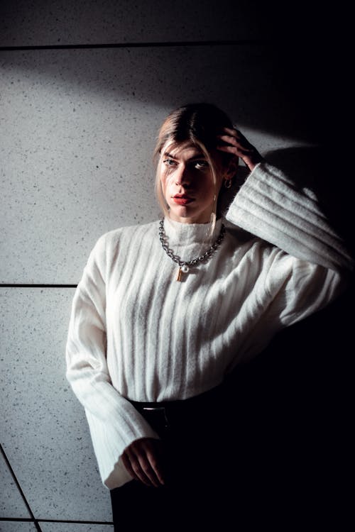 Woman Standing in White Sweater