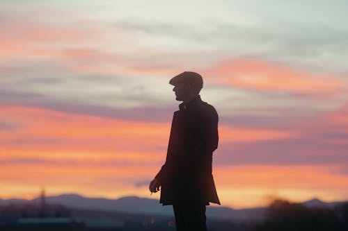 A Man in a Hat at Sunset 