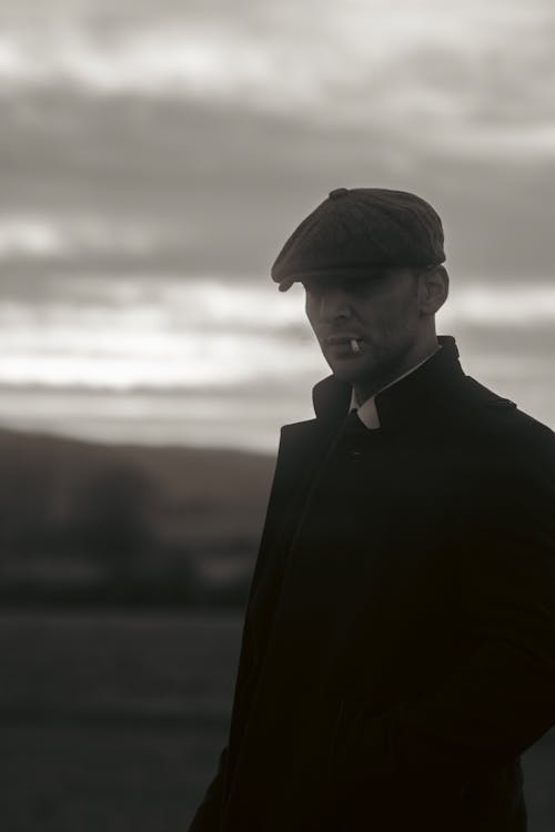 Man in Jacket and Hat in Black and White