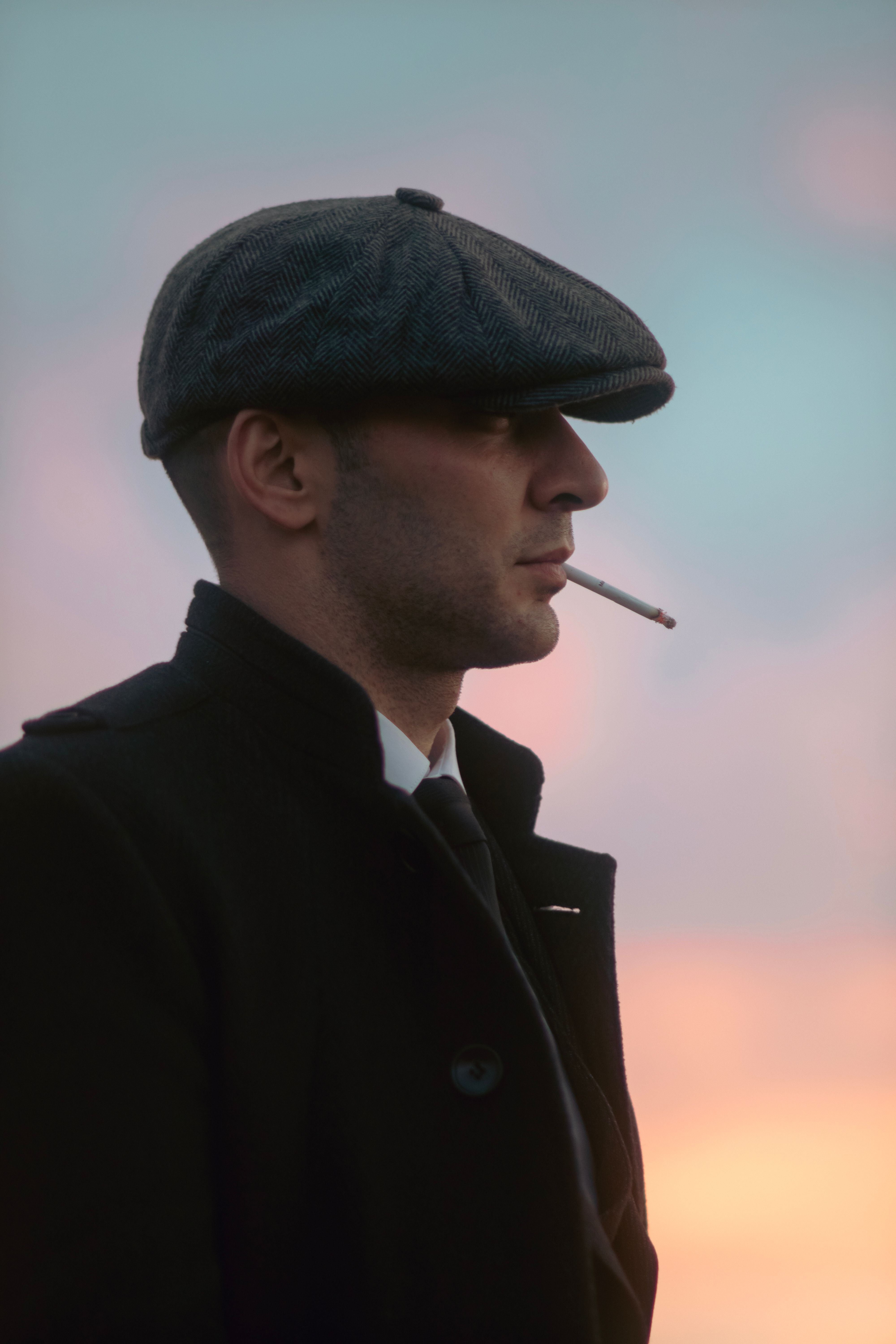 mouth holding cigarette Man in Black Coat and Gray Newsboy Cap Holding a Cigarette in his Mouth ·  Free Stock Photo