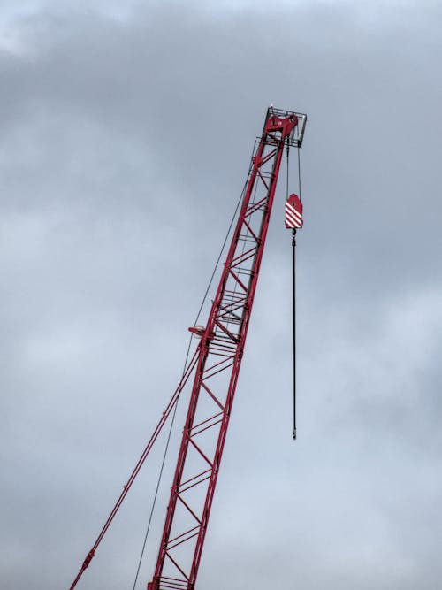 Low Angle Shot of a Crane at a Construction Site 