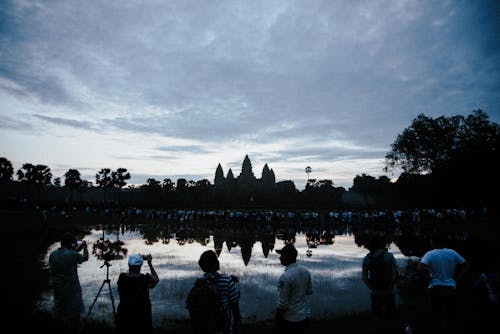 People Taking Photos of Angkor Wat Temple at Dusk