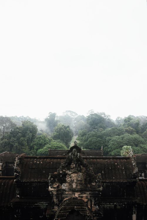 Free Scenic view of an ancient temple amidst a misty forest, evoking a sense of mystery. Stock Photo