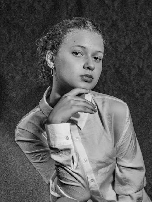 Black and White Studio Portrait of a Young Woman in White Shirt