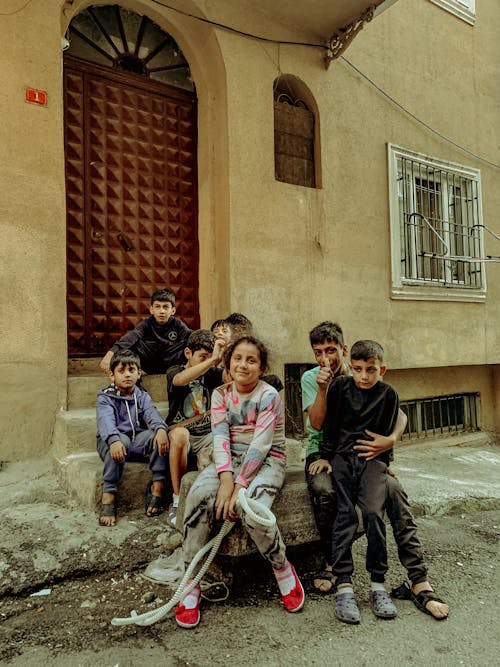 Children Sitting on Stairs