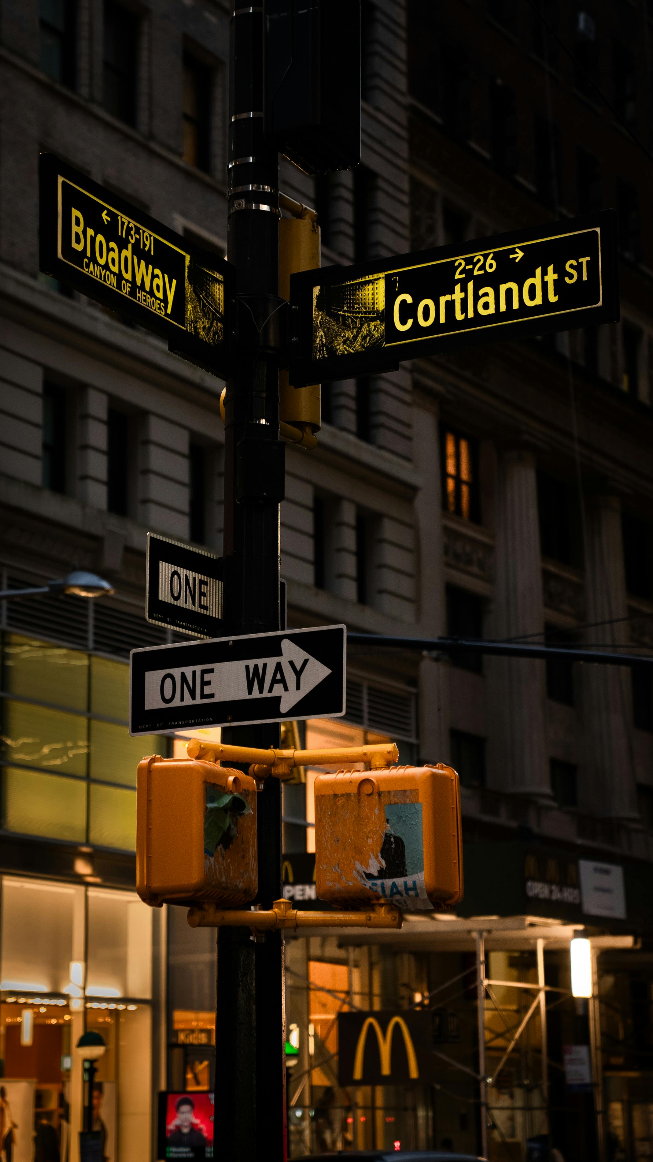 A street sign with a yellow container sign · Free Stock Photo