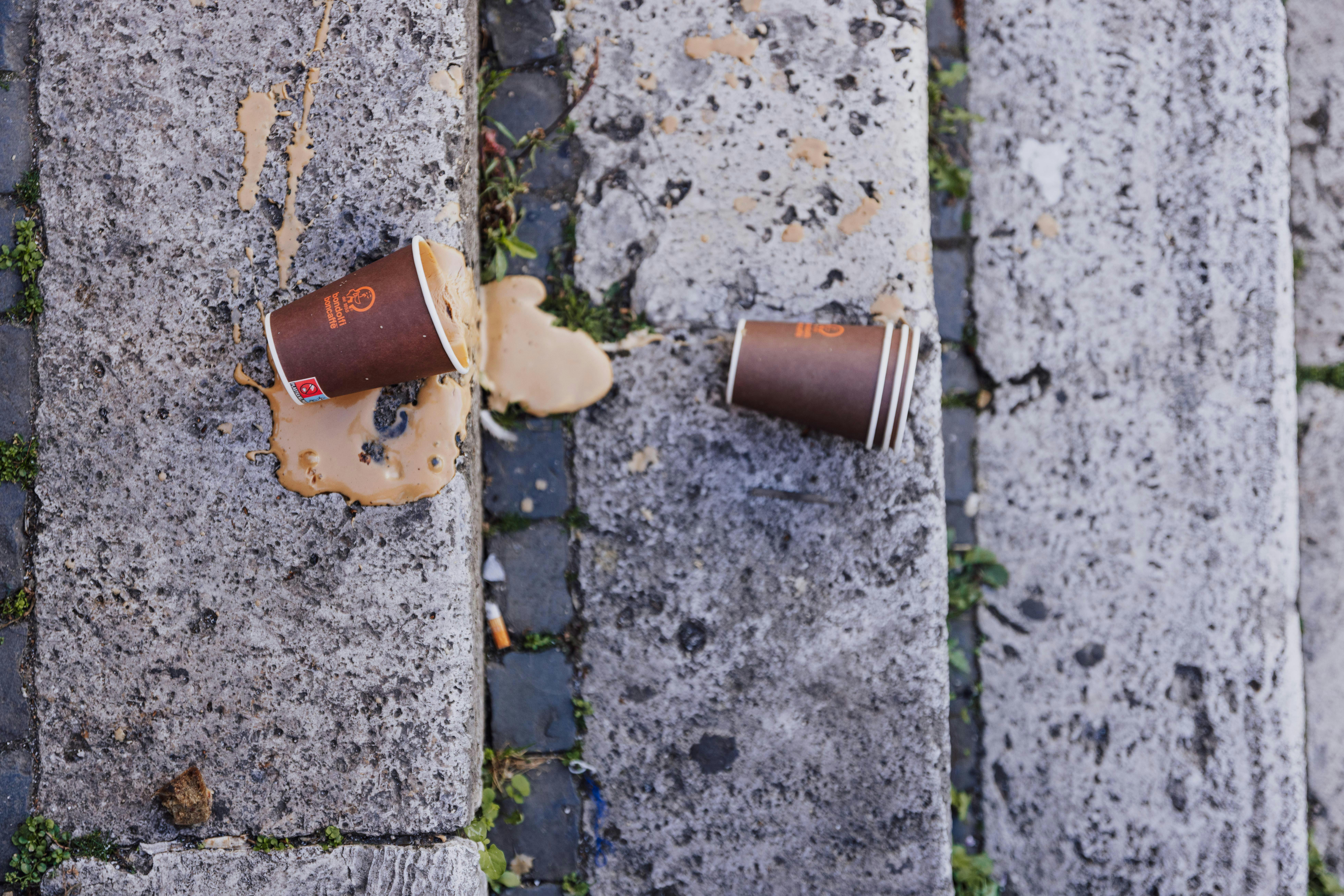 Cups Lying Down and Coffee Spilled on Planks · Free Stock Photo