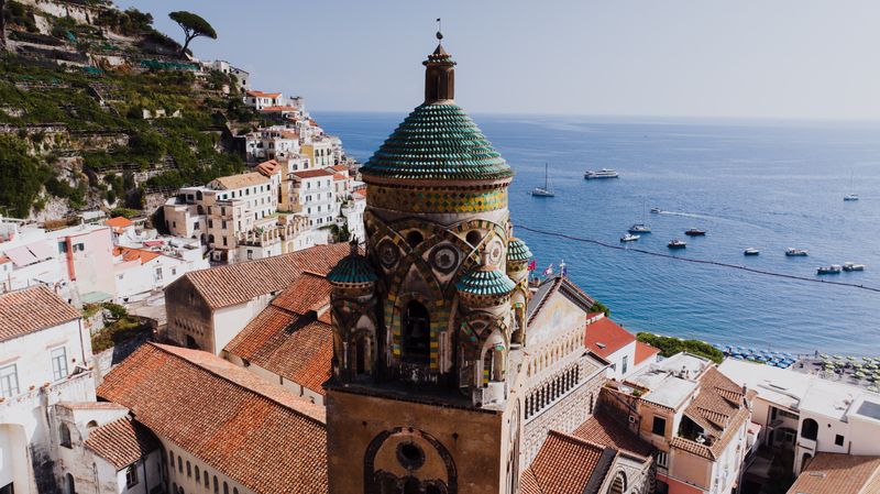 Bell tower of Amalfi Cathedral rising above the town rooftops