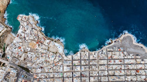 Aerial View of City over Blue Sea