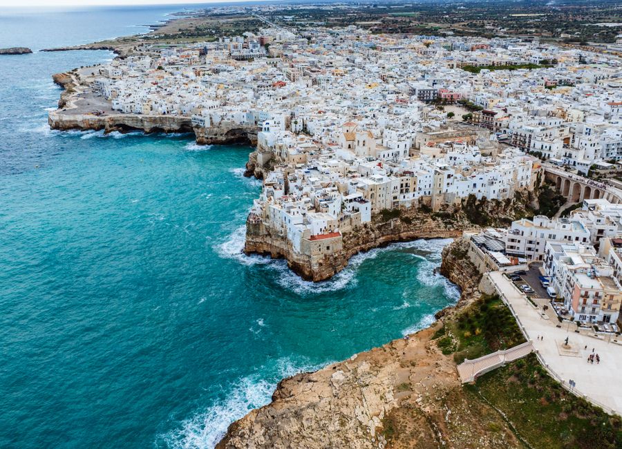 Stunning aerial view of Polignano a Mare, Italy, showcasing its coastal beauty and historic architecture.