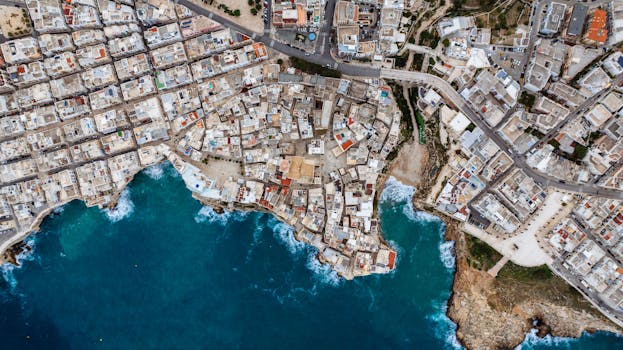 A stunning aerial view of the coastal town Polignano a Mare in Puglia, Italy.