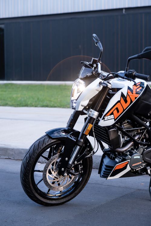 Free High-performance KTM motorcycle parked on urban street, showcasing modern design and style. Stock Photo