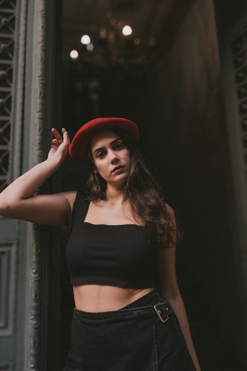 Model in a Red Beret and a Black Crop Top Posing in the Entrance