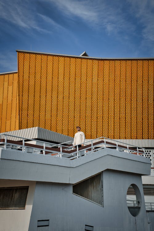 Man Standing near Wall of Berliner Philharmonie