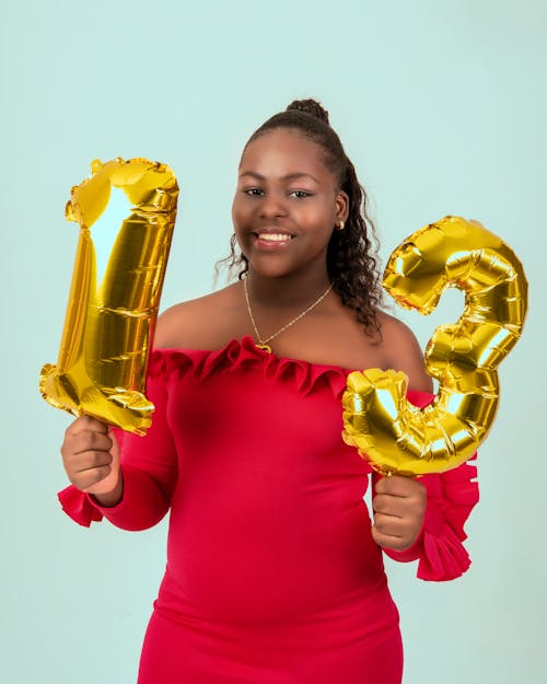 African Woman Holding Balloons 