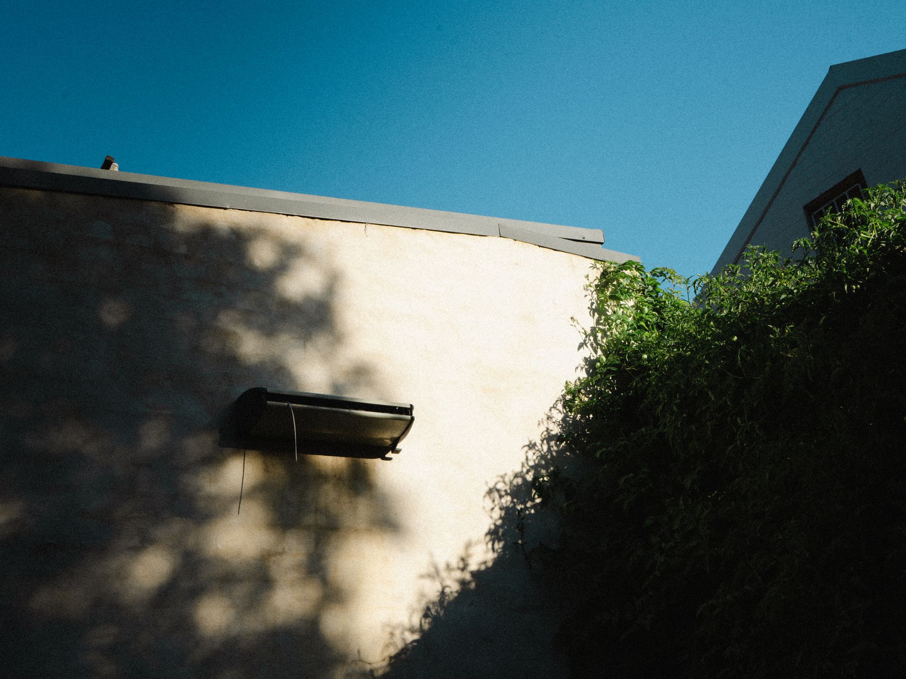 Exterior Painting in Elmstead — careful masking before painting begins