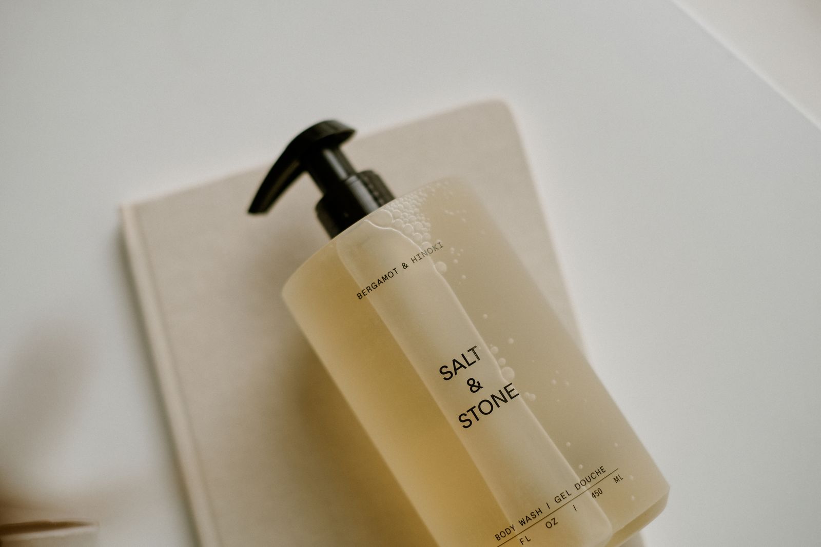Body wash pump bottle on a stone tray
