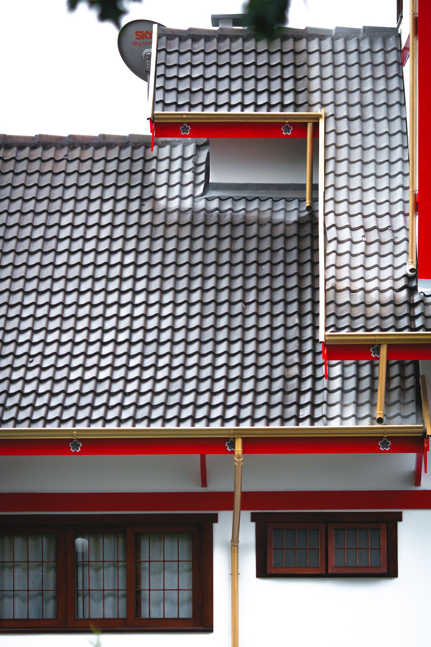 Close view of a tiled roof and eaves on a house