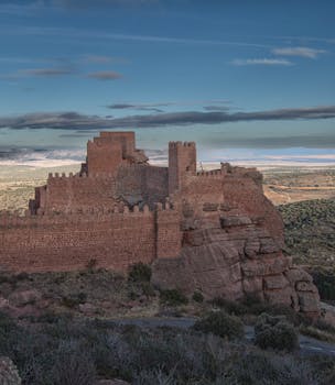 Peracense Castle, an iconic medieval landmark in Spain, surrounded by scenic plains.