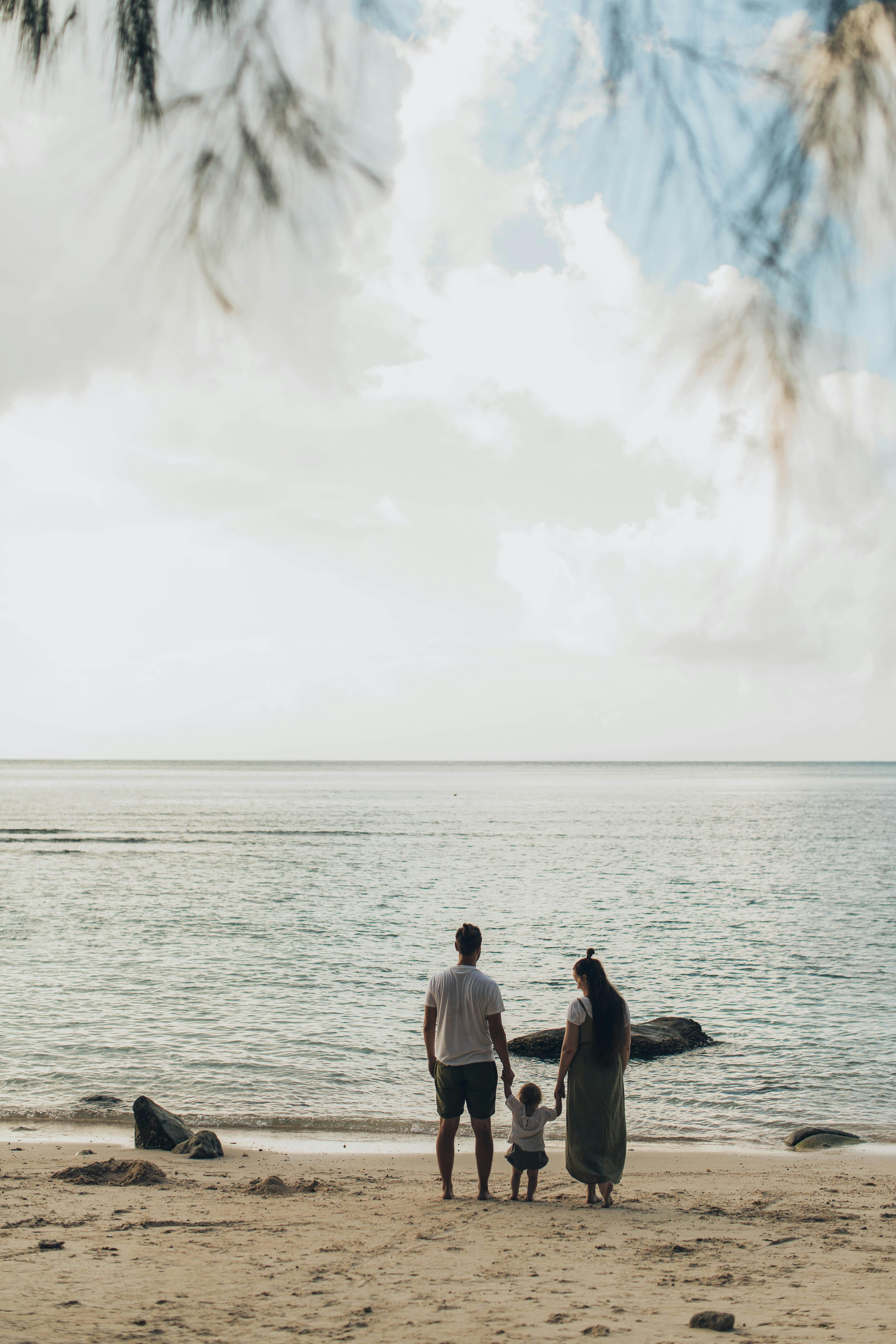 woman and man standing at shores