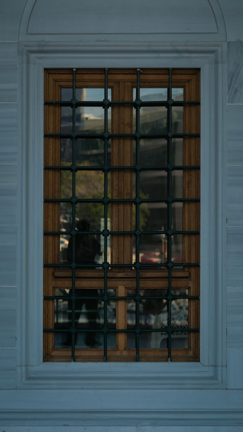 Window Texture Bared Close-up of a Barred Window with a Wooden Frame · Free Stock Photo