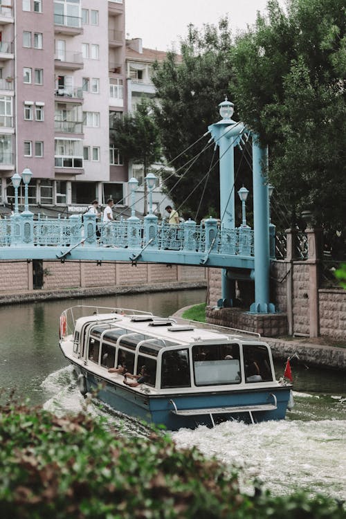 Ferry Passing Under a Suspended Footbridge on the Porsuk River in Eskisehir