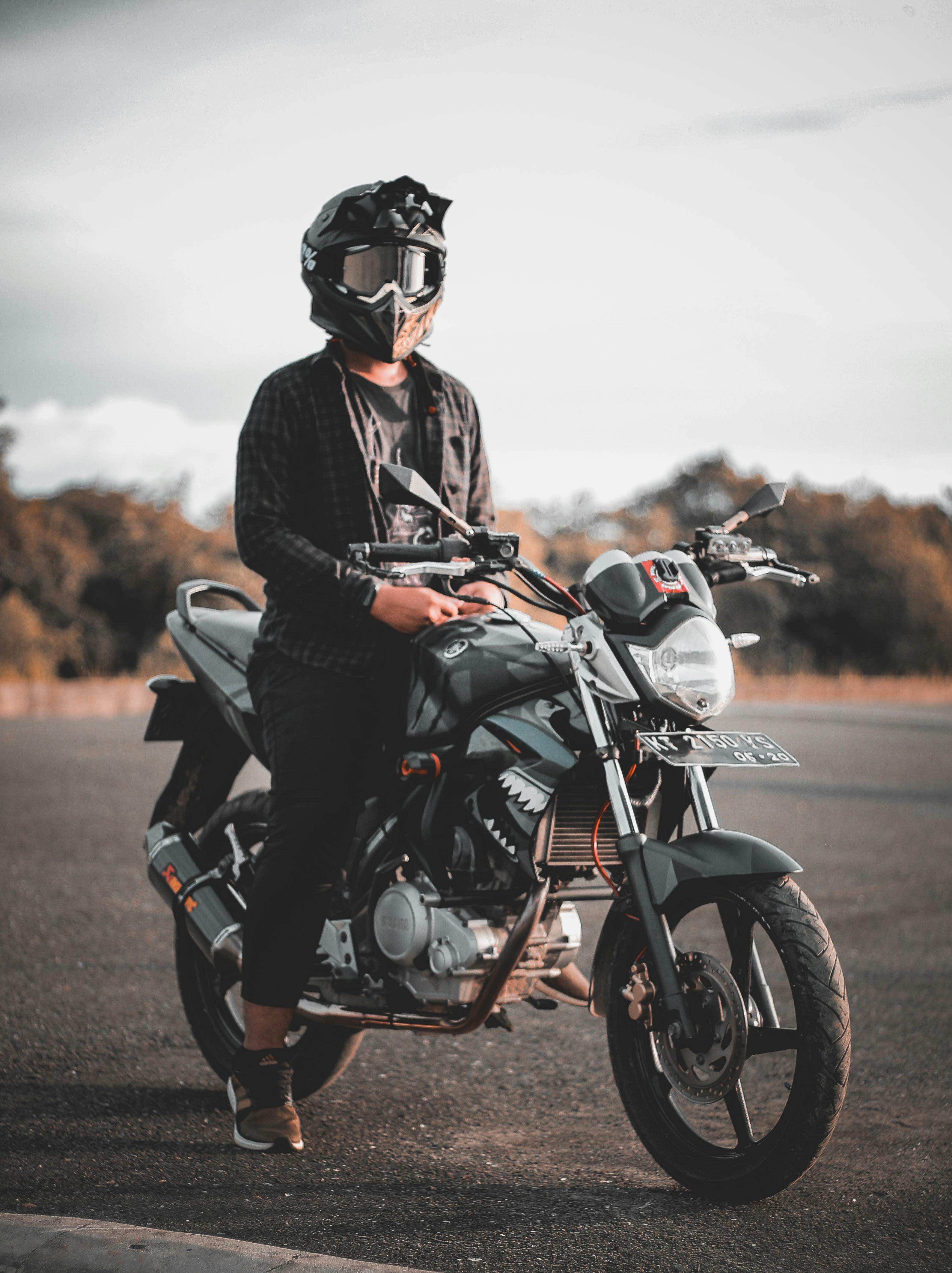 Man Riding Gray Backbone Motorcycle · Free Stock Photo