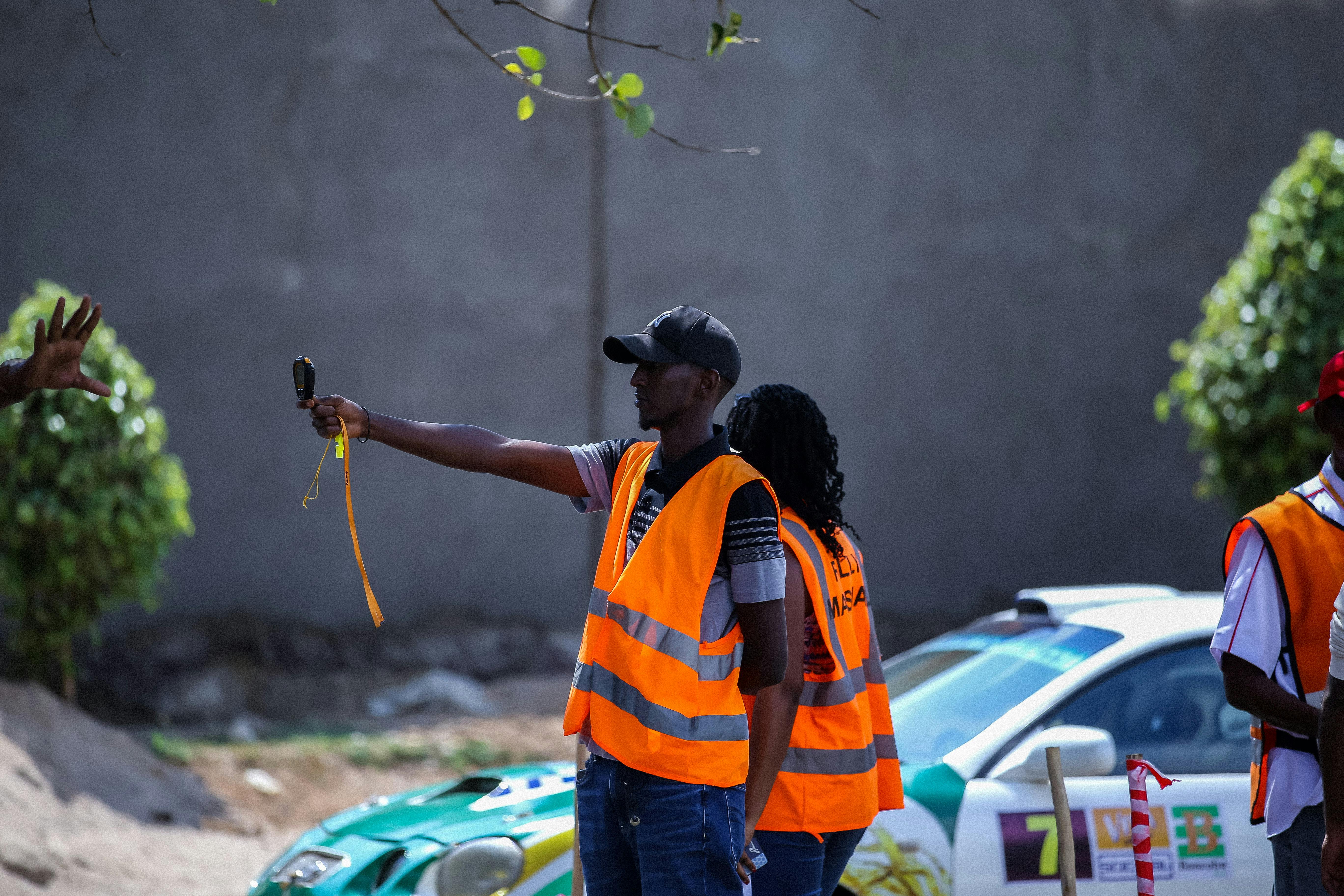 Safety Officers in Reflective Clothing Standing on the Road · Free